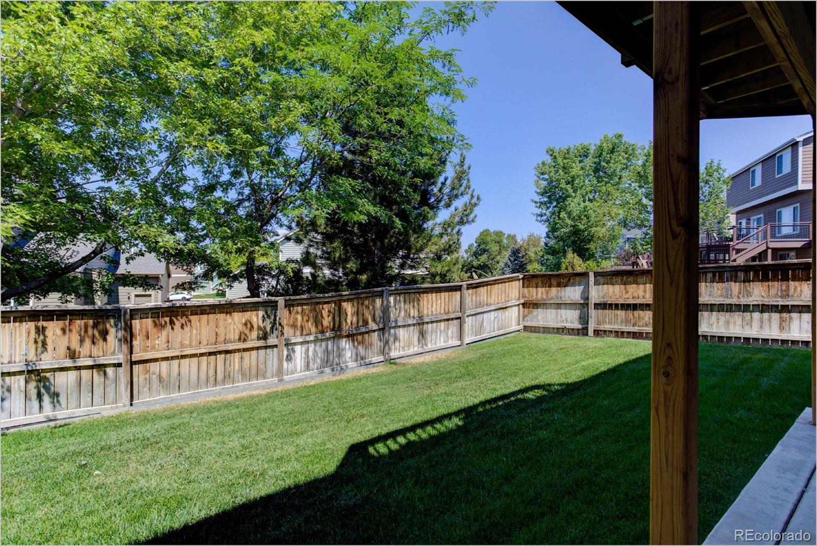1021 Riddlewood Road Highlands Ranch, CO 80129 - Photo 25 of 29 a view of a backyard with a garden