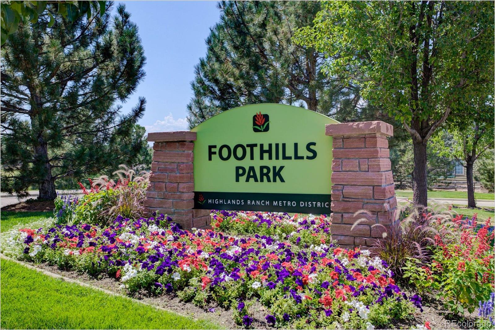 1021 Riddlewood Road Highlands Ranch, CO 80129 - Photo 27 of 29 a sign that is in front of flowers