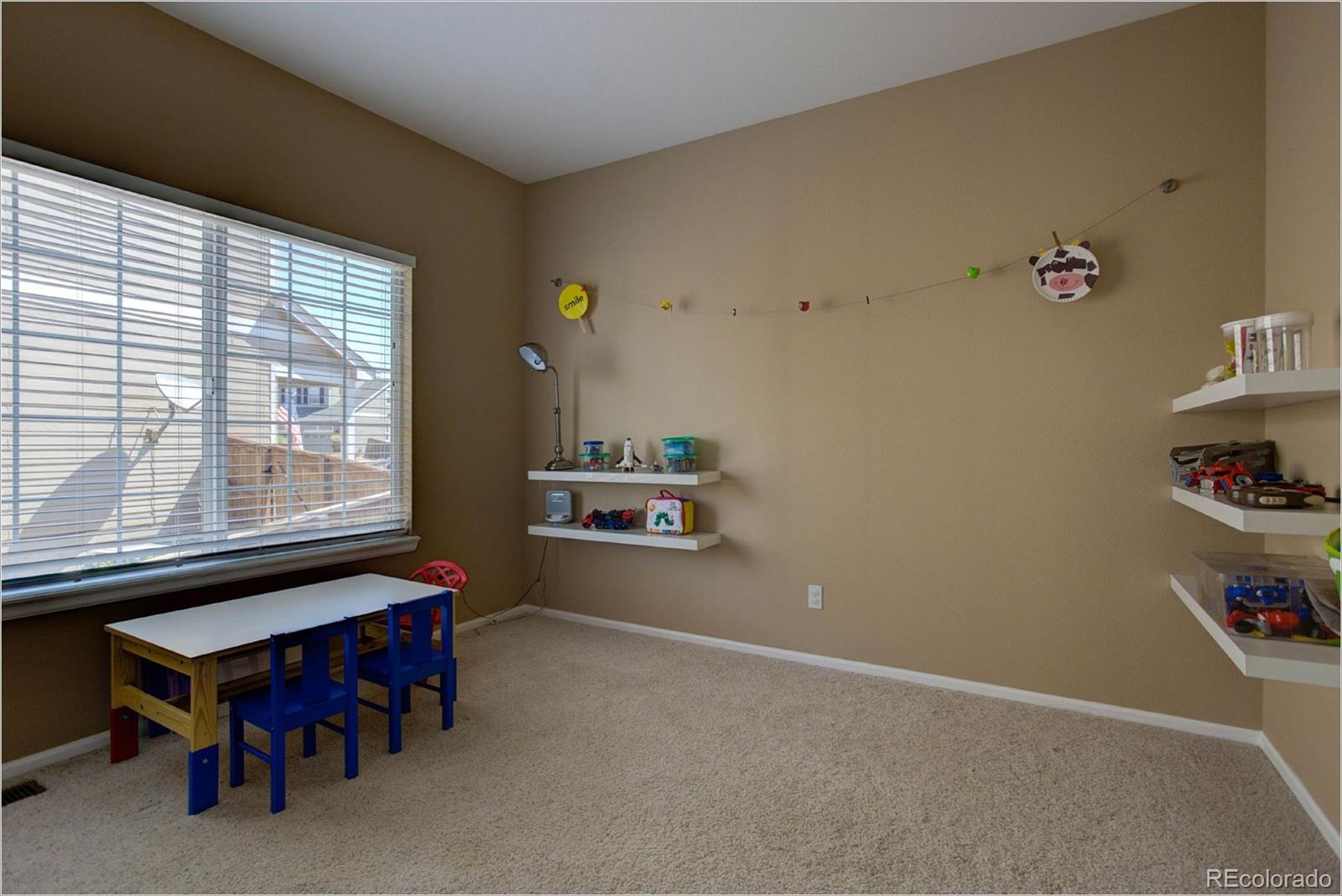 1021 Riddlewood Road Highlands Ranch, CO 80129 - Photo 8 of 29 a room with furniture and window