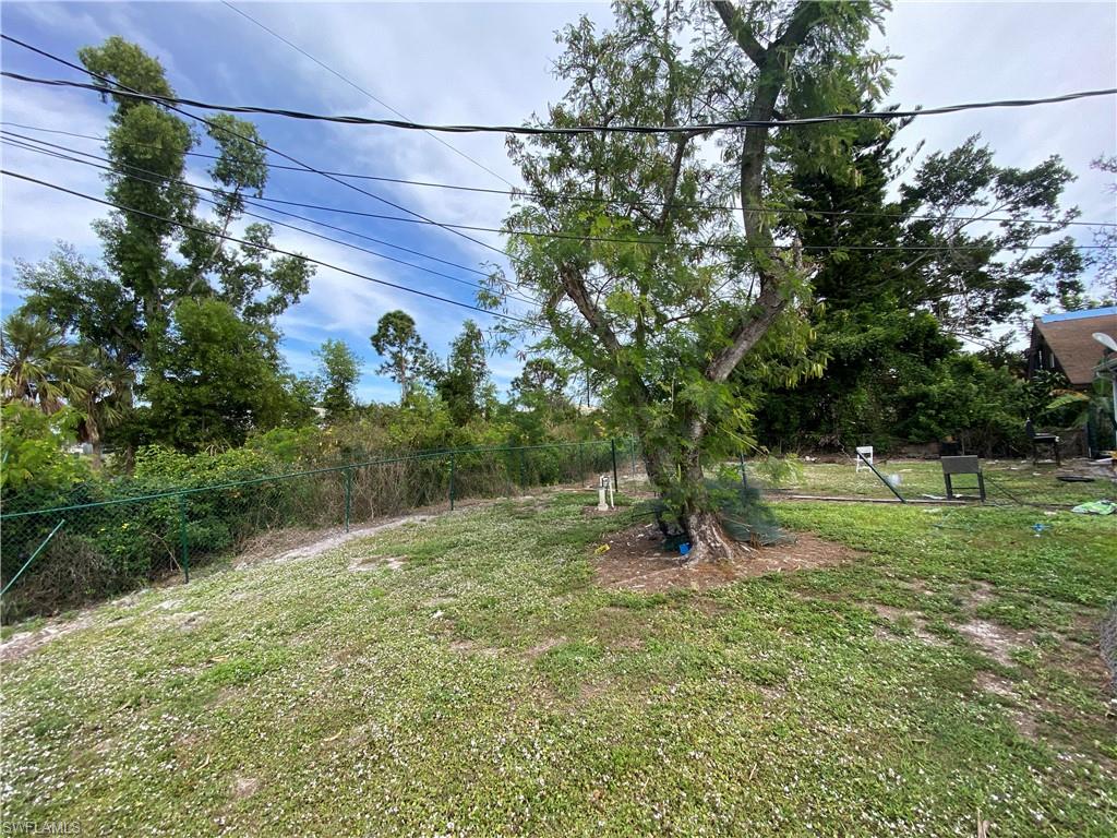 7319 Albany Road Fort Myers, FL 33967 - Photo 24 of 27 a backyard of a house with lots of green space