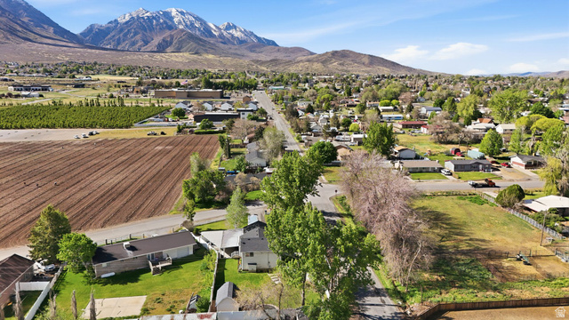 415 East 400 North Santaquin, UT 84655 - Photo 36 of 39 Aerial perspective showcasing a residential area with a prominent mountain backdrop