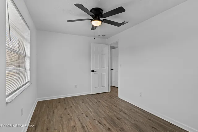 a view of an empty room with a fireplace