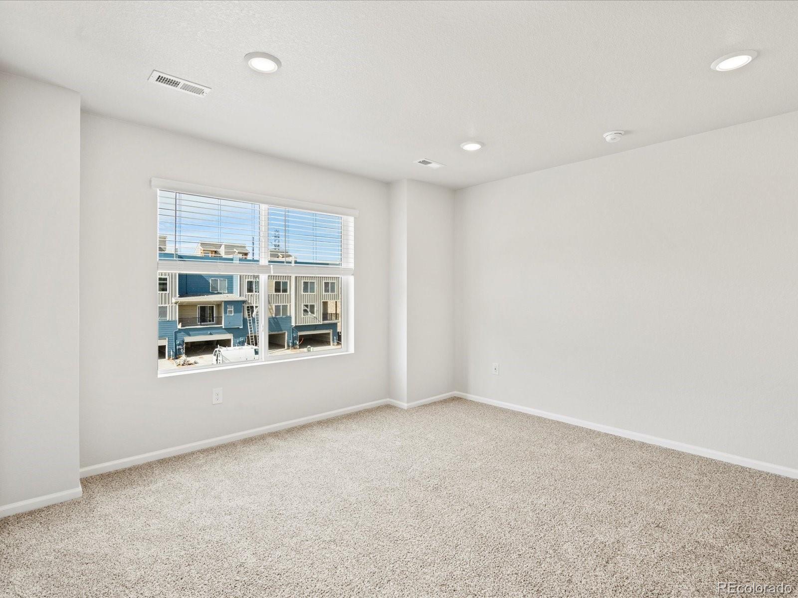14412 Pansy Loop Morrison, CO 80465 - Photo 20 of 34 an empty room with a window