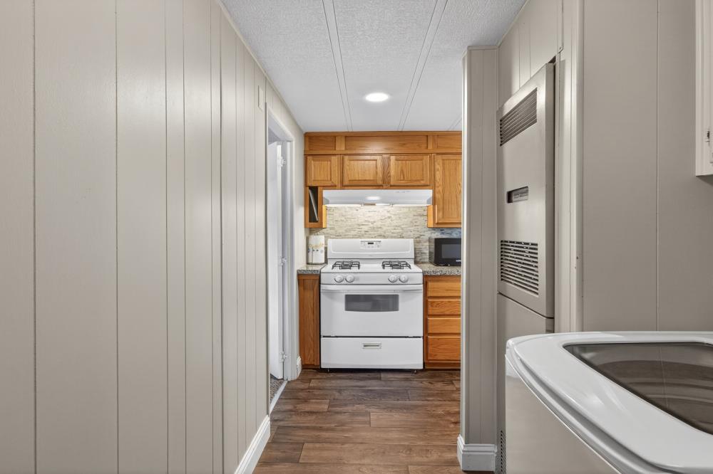 7460 Azimuth Lane, Unit 253 Sacramento, CA 95842 - Photo 16 of 50 a kitchen with stainless steel appliances granite countertop a stove and a refrigerator