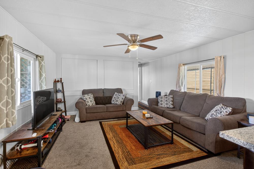 7460 Azimuth Lane, Unit 253 Sacramento, CA 95842 - Photo 20 of 50 a living room with furniture a ceiling fan and a window