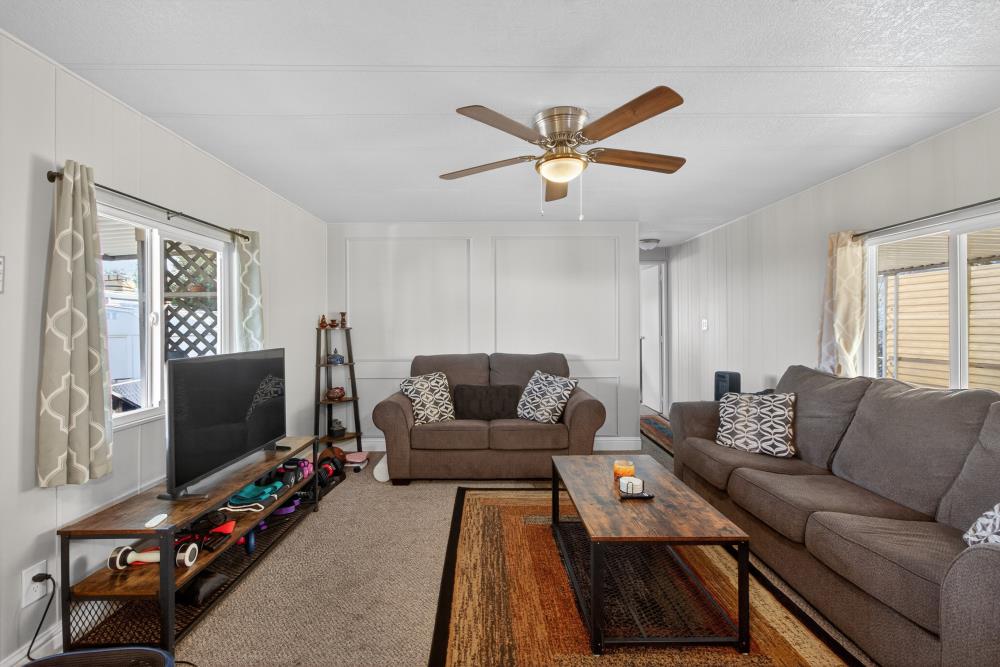 7460 Azimuth Lane, Unit 253 Sacramento, CA 95842 - Photo 23 of 50 a living room with furniture and a flat screen tv