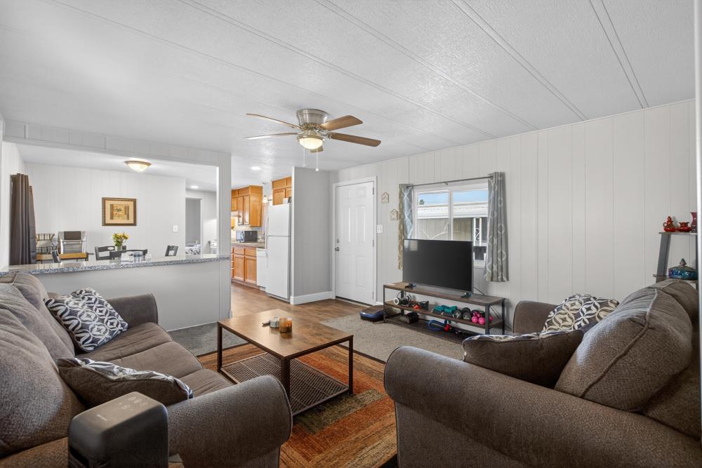 7460 Azimuth Lane, Unit 253 Sacramento, CA 95842 - Photo 24 of 50 a living room with furniture and a flat screen tv