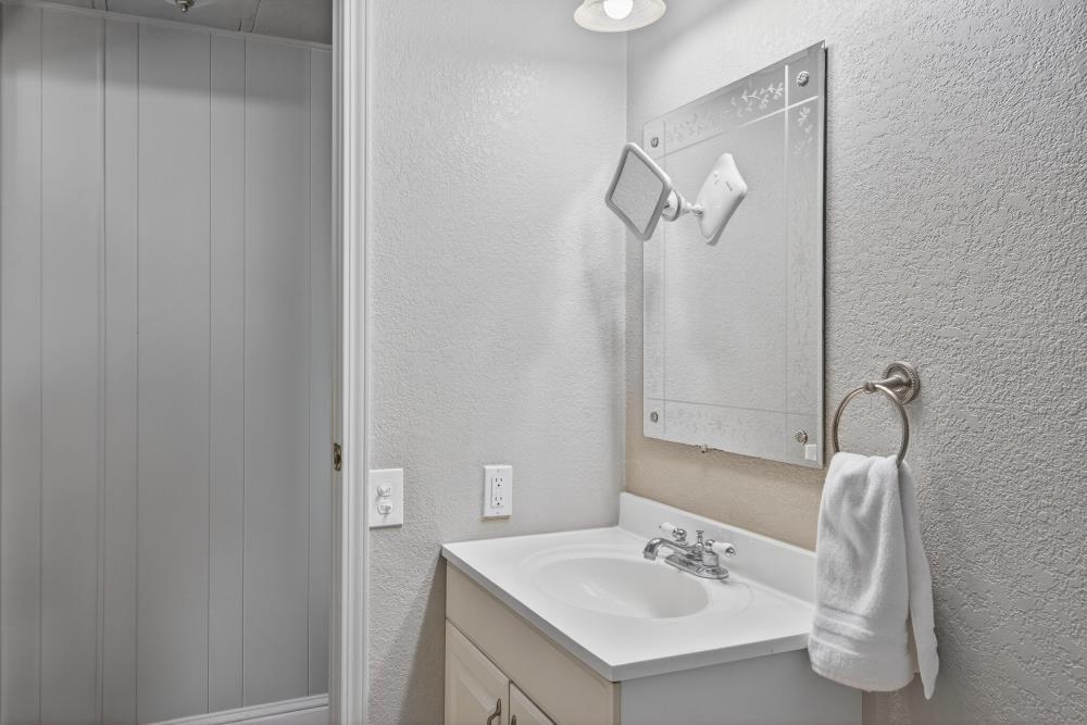 7460 Azimuth Lane, Unit 253 Sacramento, CA 95842 - Photo 30 of 50 a bathroom with a sink and a mirror