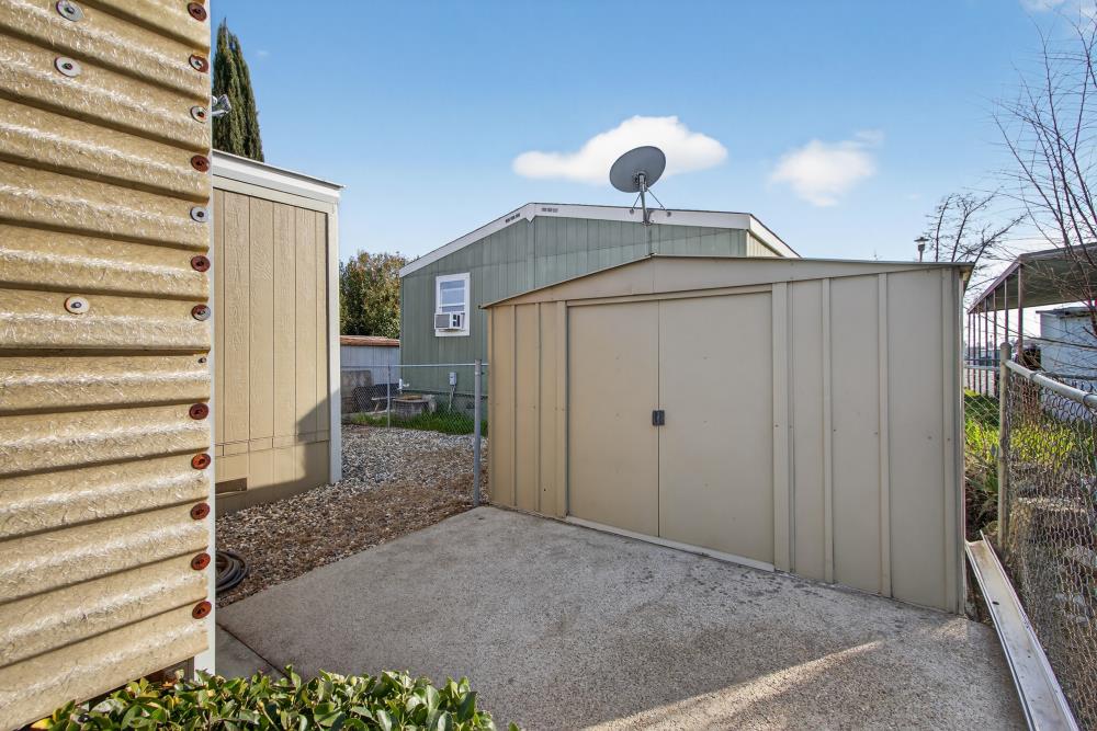 7460 Azimuth Lane, Unit 253 Sacramento, CA 95842 - Photo 33 of 50 a front view of a house with a yard and garage