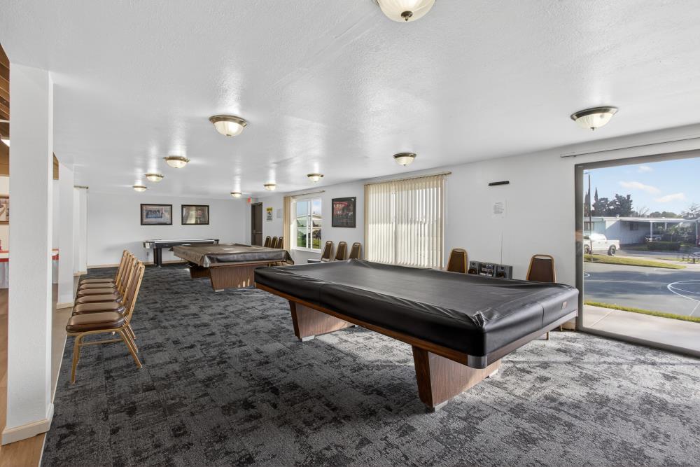 7460 Azimuth Lane, Unit 253 Sacramento, CA 95842 - Photo 41 of 50 a living room with furniture a rug and kitchen view