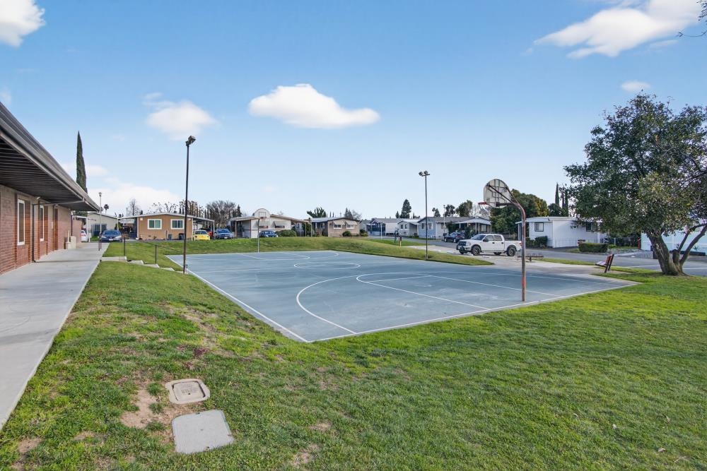 7460 Azimuth Lane, Unit 253 Sacramento, CA 95842 - Photo 44 of 50 a swimming pool with outdoor seating and yard