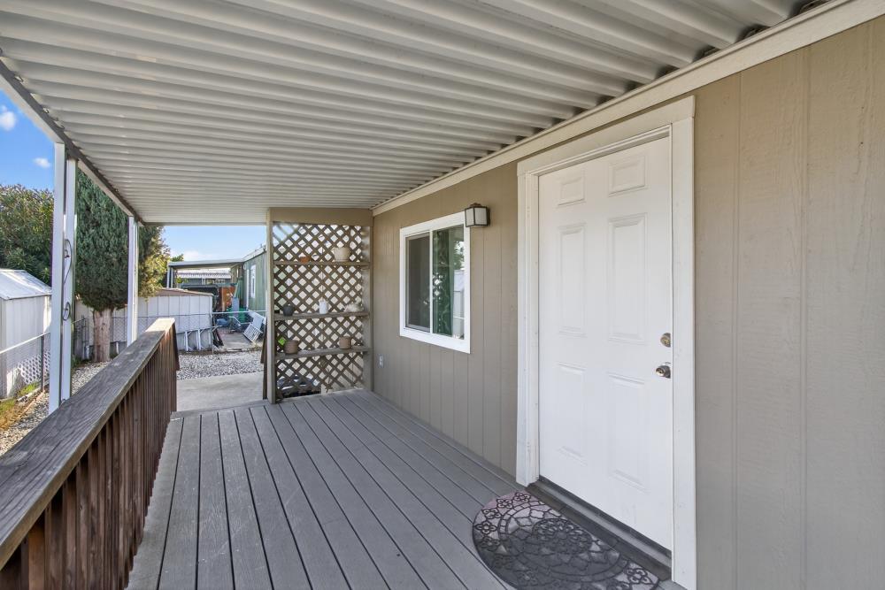 7460 Azimuth Lane, Unit 253 Sacramento, CA 95842 - Photo 6 of 50 a view of a porch with wooden floor and iron stairs