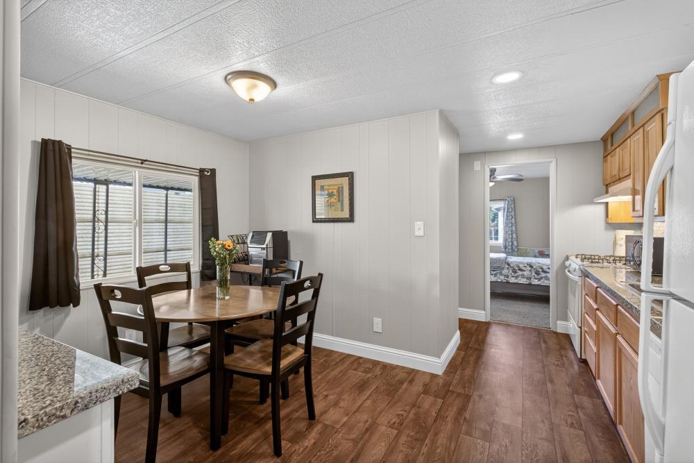 7460 Azimuth Lane, Unit 253 Sacramento, CA 95842 - Photo 7 of 50 a view of a dining room with furniture and a livingroom