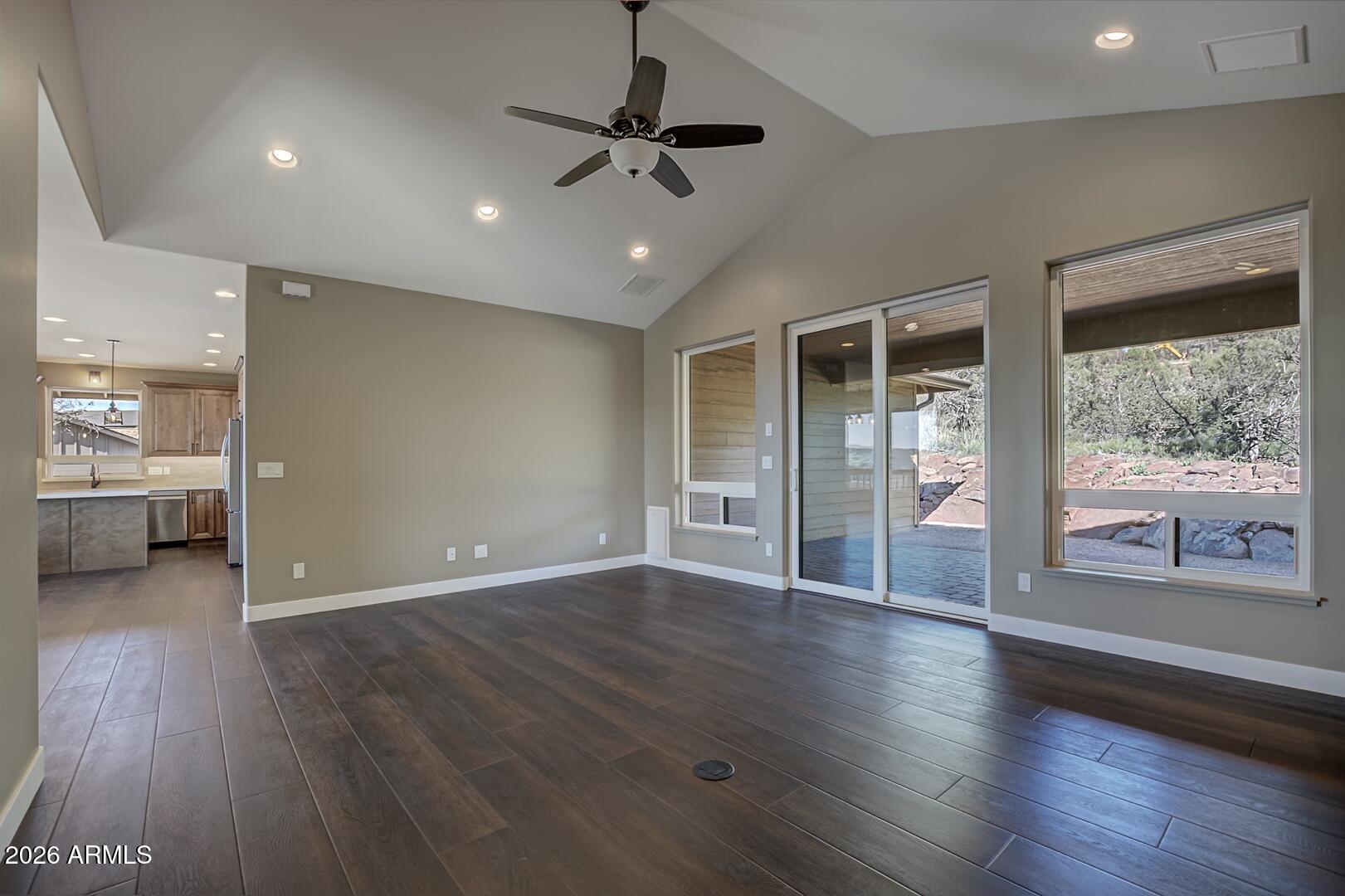 504 North Wagon Court Payson, AZ 85541 - Photo 12 of 21 a view of an empty room with a window and wooden floor