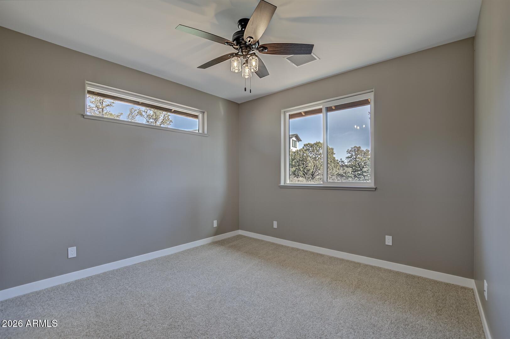 504 North Wagon Court Payson, AZ 85541 - Photo 13 of 21 an empty room with windows and fan