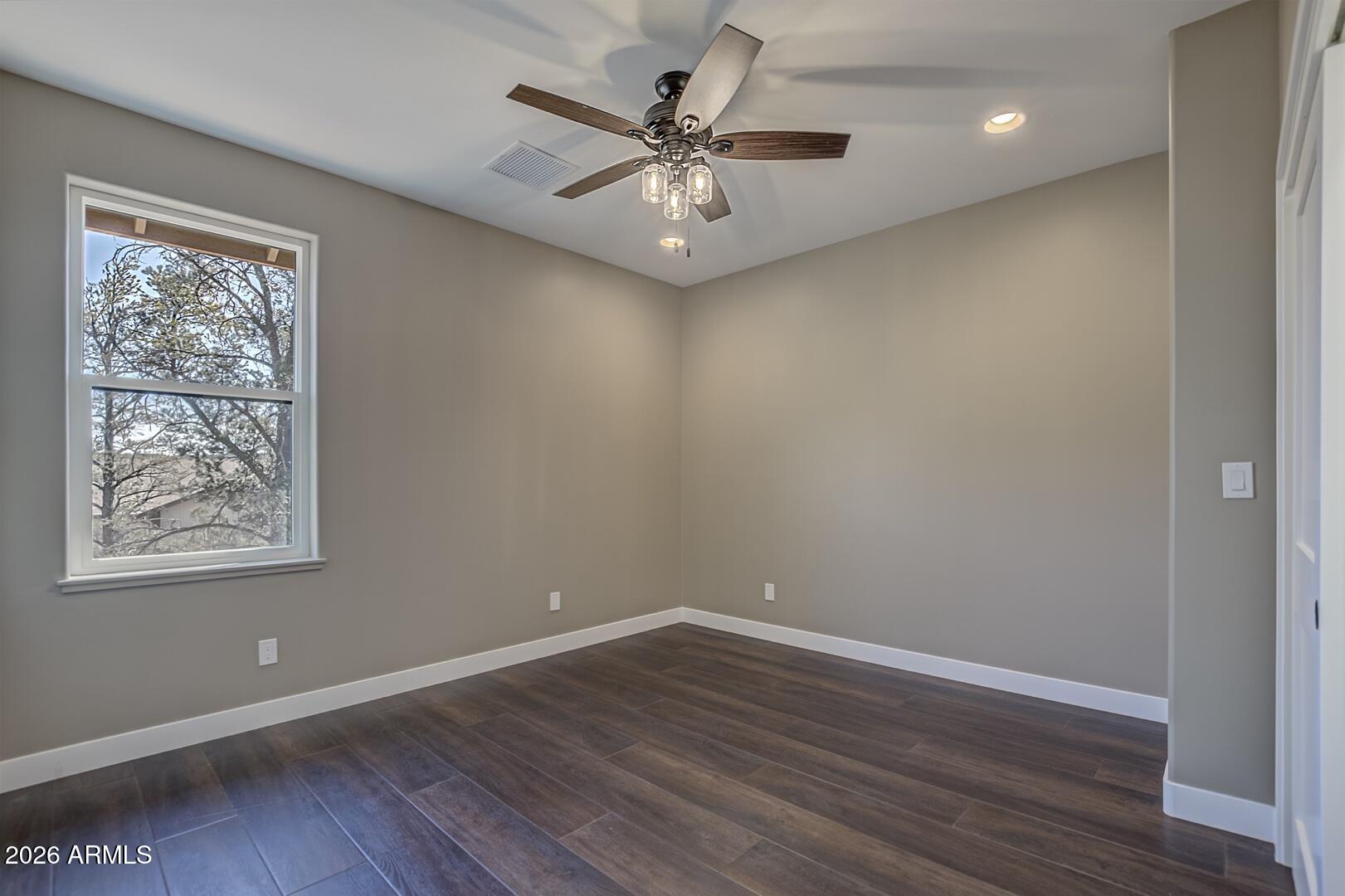 504 North Wagon Court Payson, AZ 85541 - Photo 16 of 21 wooden floor in an empty room with a window