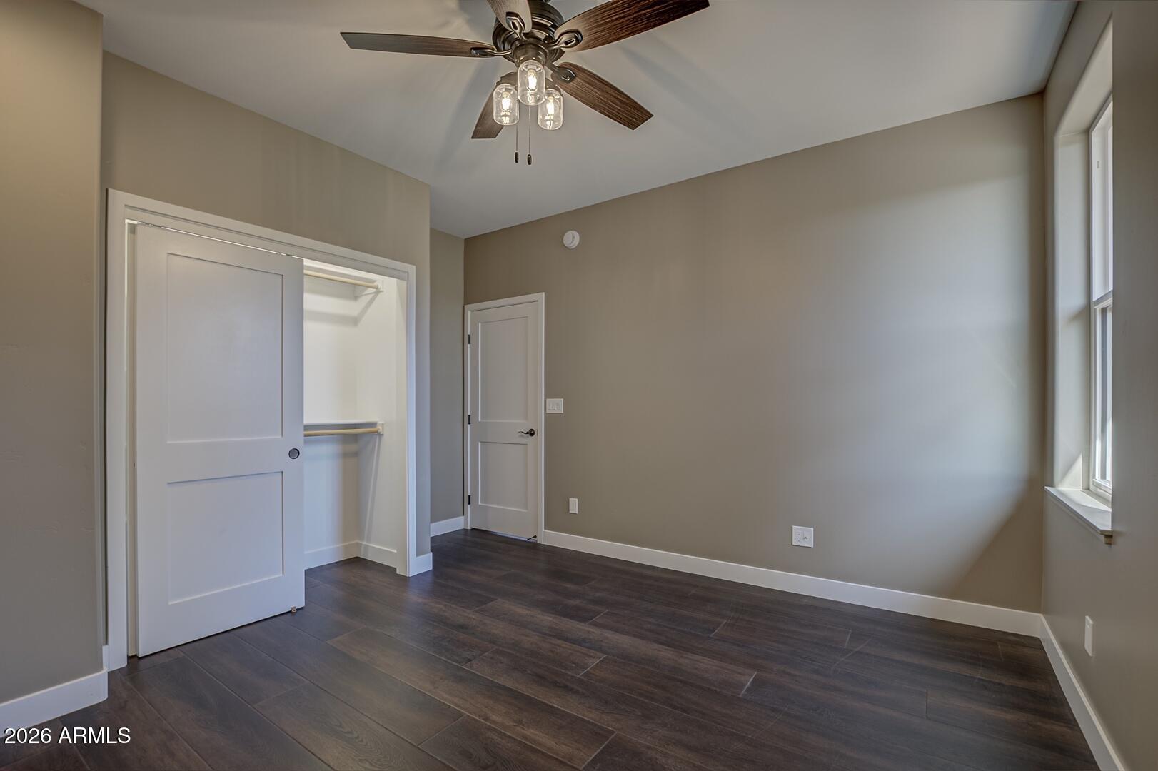 504 North Wagon Court Payson, AZ 85541 - Photo 17 of 21 an empty room with wooden floor closet and windows