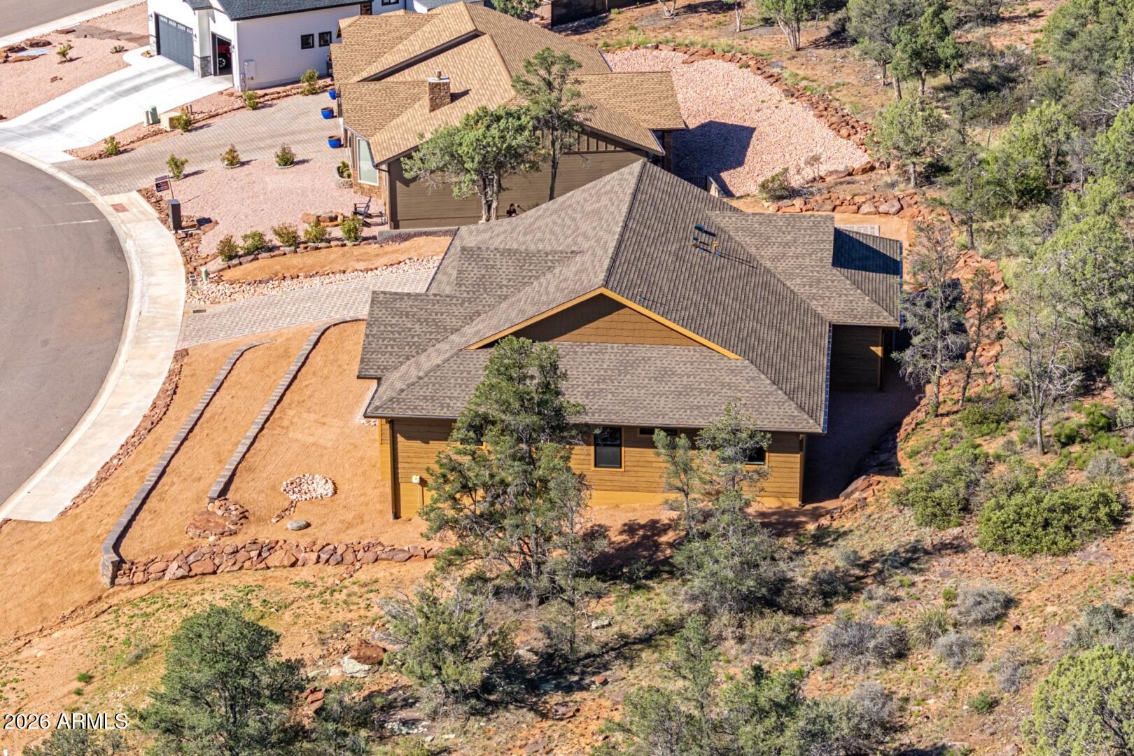 504 North Wagon Court Payson, AZ 85541 - Photo 20 of 21 an aerial view of a house with a yard and potted plants