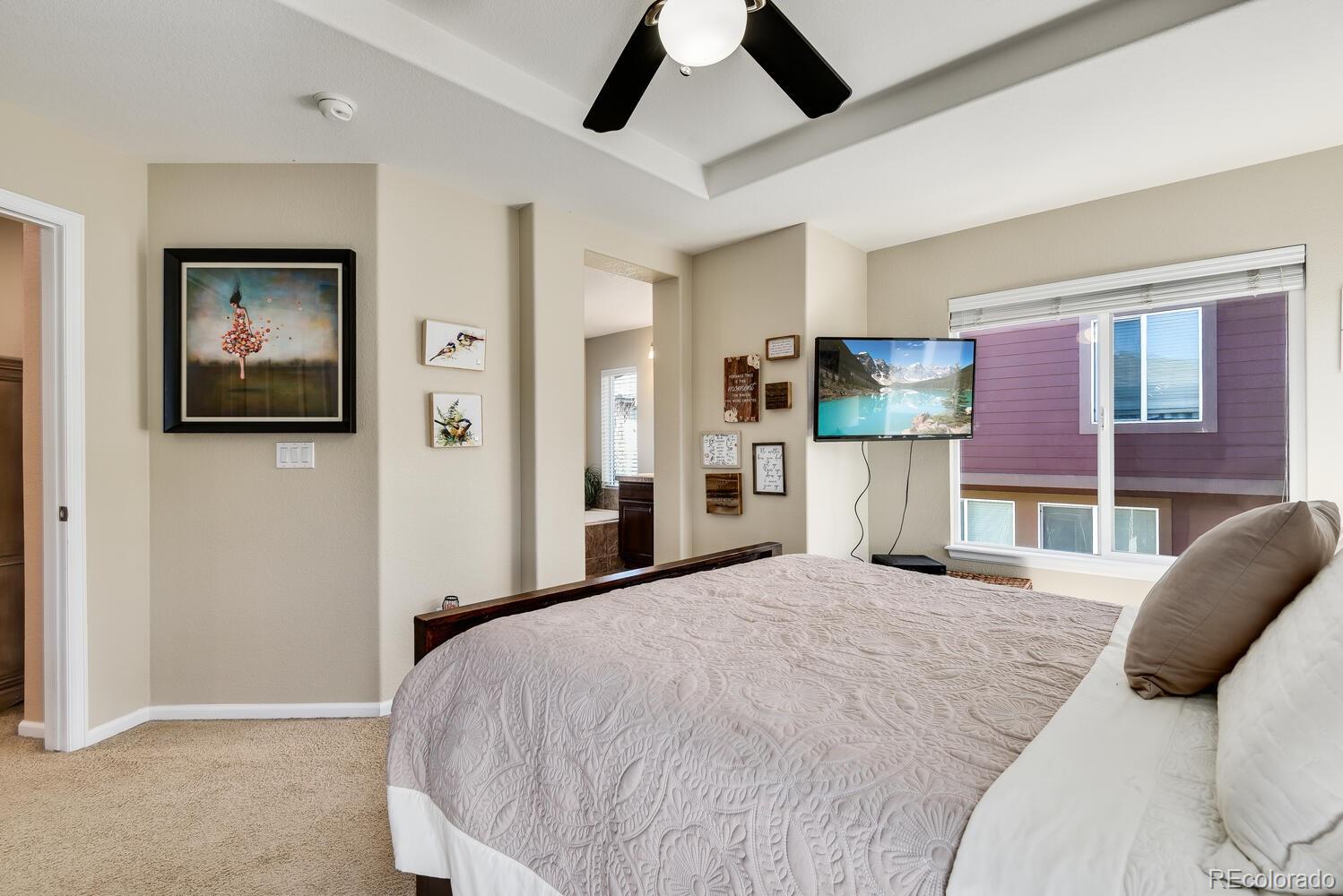 10842 Brooklawn Road Highlands Ranch, CO 80130 - Photo 15 of 35 a bedroom with a bed and dresser