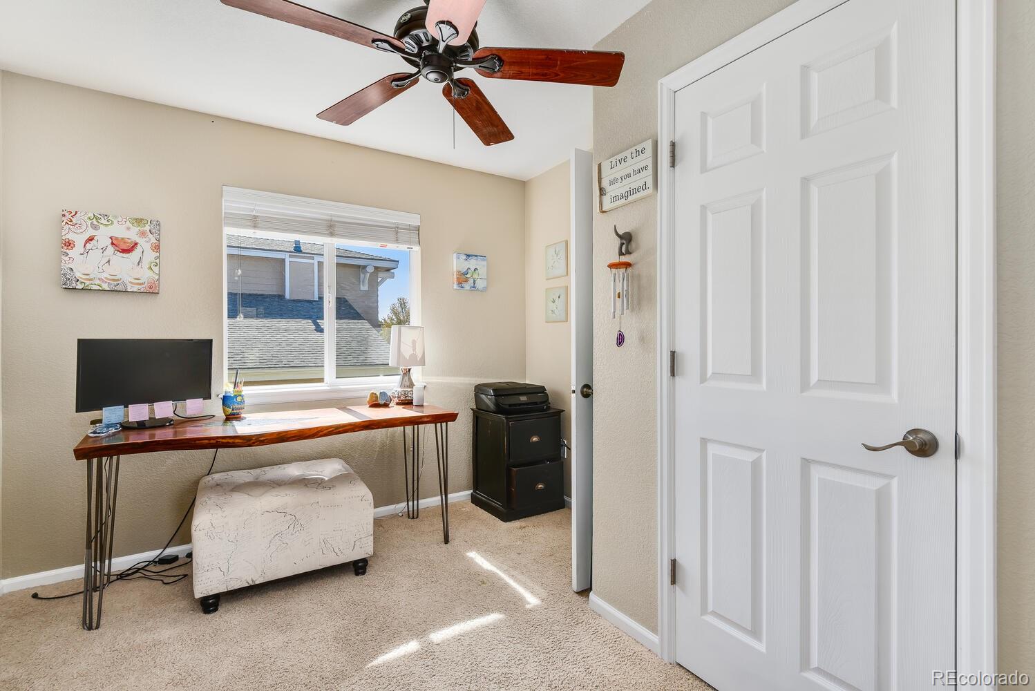 10842 Brooklawn Road Highlands Ranch, CO 80130 - Photo 21 of 35 a room with furniture and window