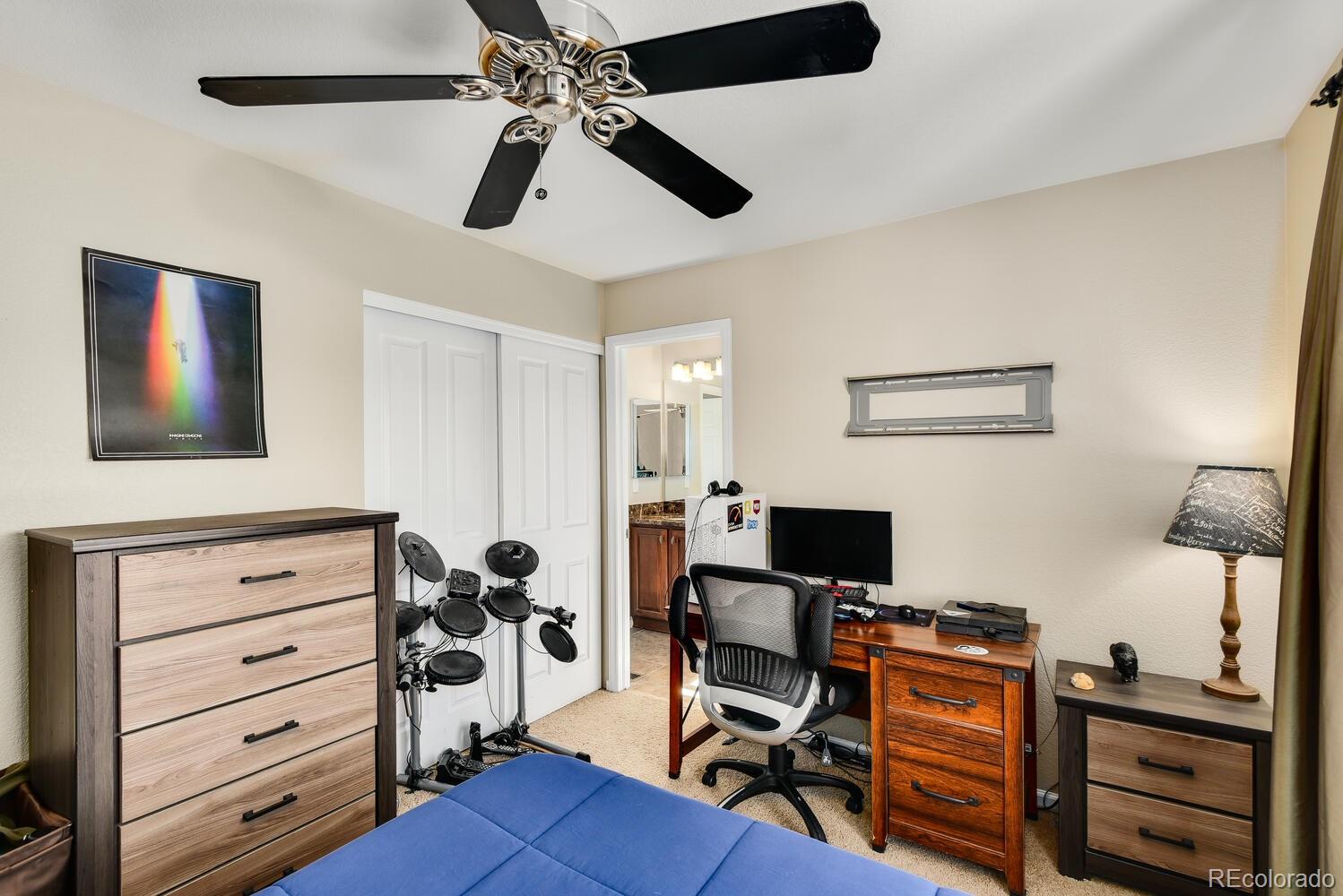 10842 Brooklawn Road Highlands Ranch, CO 80130 - Photo 23 of 35 a view of a workspace with furniture and a window