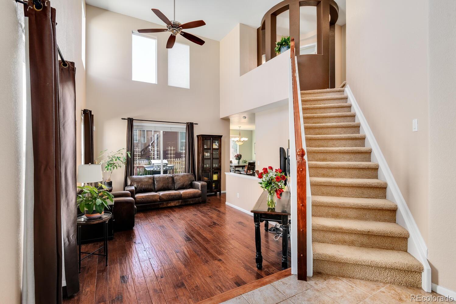 10842 Brooklawn Road Highlands Ranch, CO 80130 - Photo 4 of 35 a view of entryway and hall with wooden floor