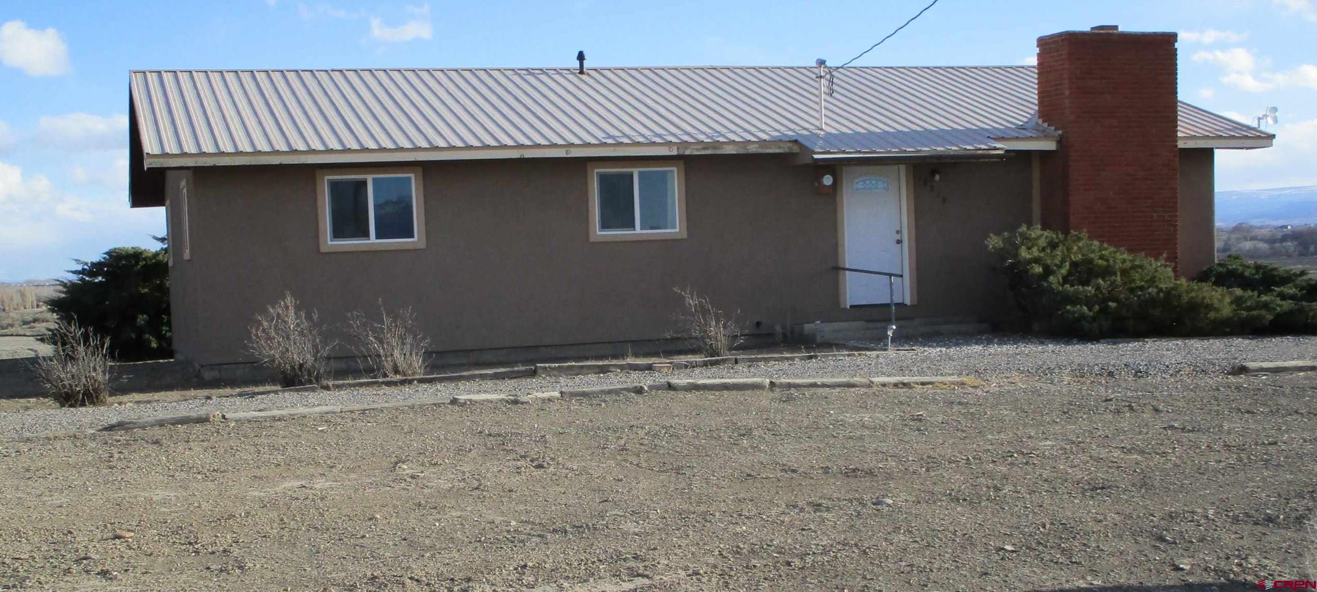 18950 Beaver Road Delta, CO 81416 - Photo 1 of 10 a front view of a house