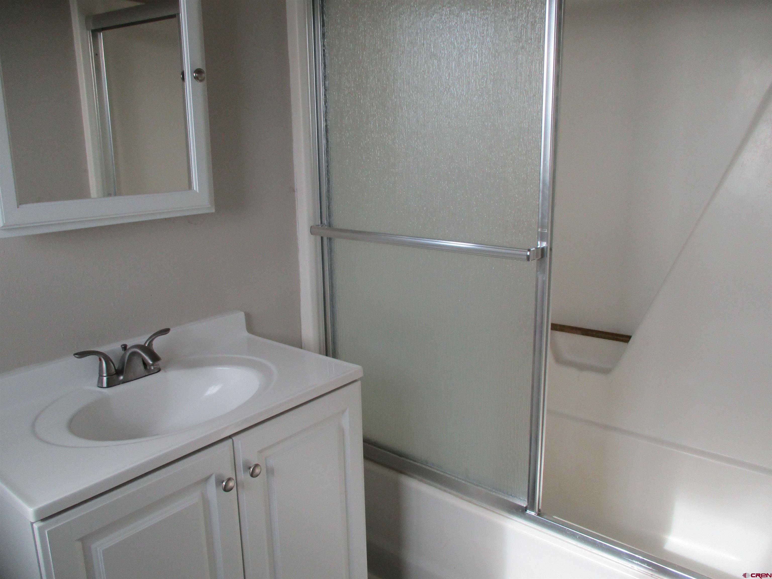 18950 Beaver Road Delta, CO 81416 - Photo 5 of 10 a bathroom with a sink and mirror
