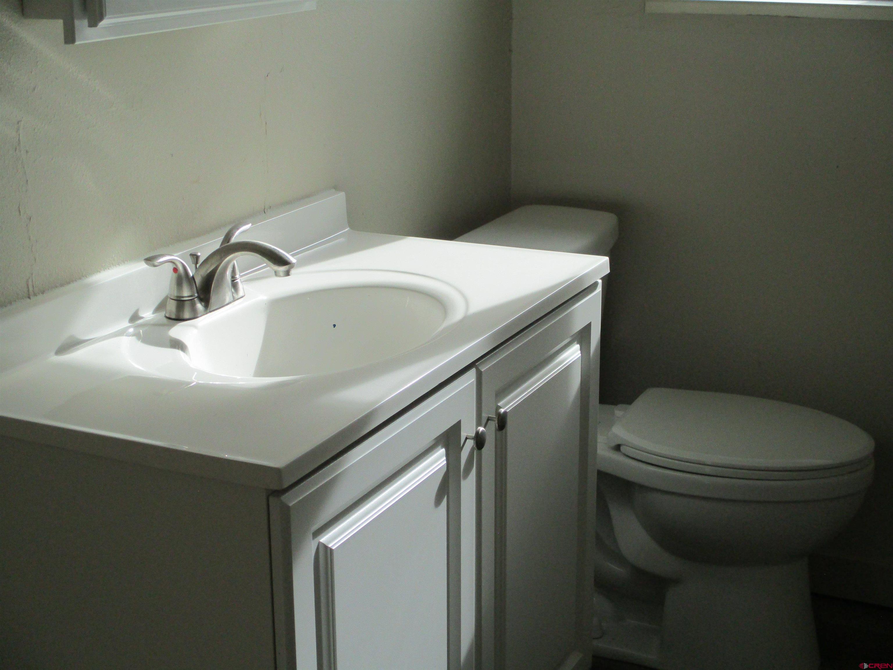 18950 Beaver Road Delta, CO 81416 - Photo 9 of 10 a bathroom with a sink and a toilet