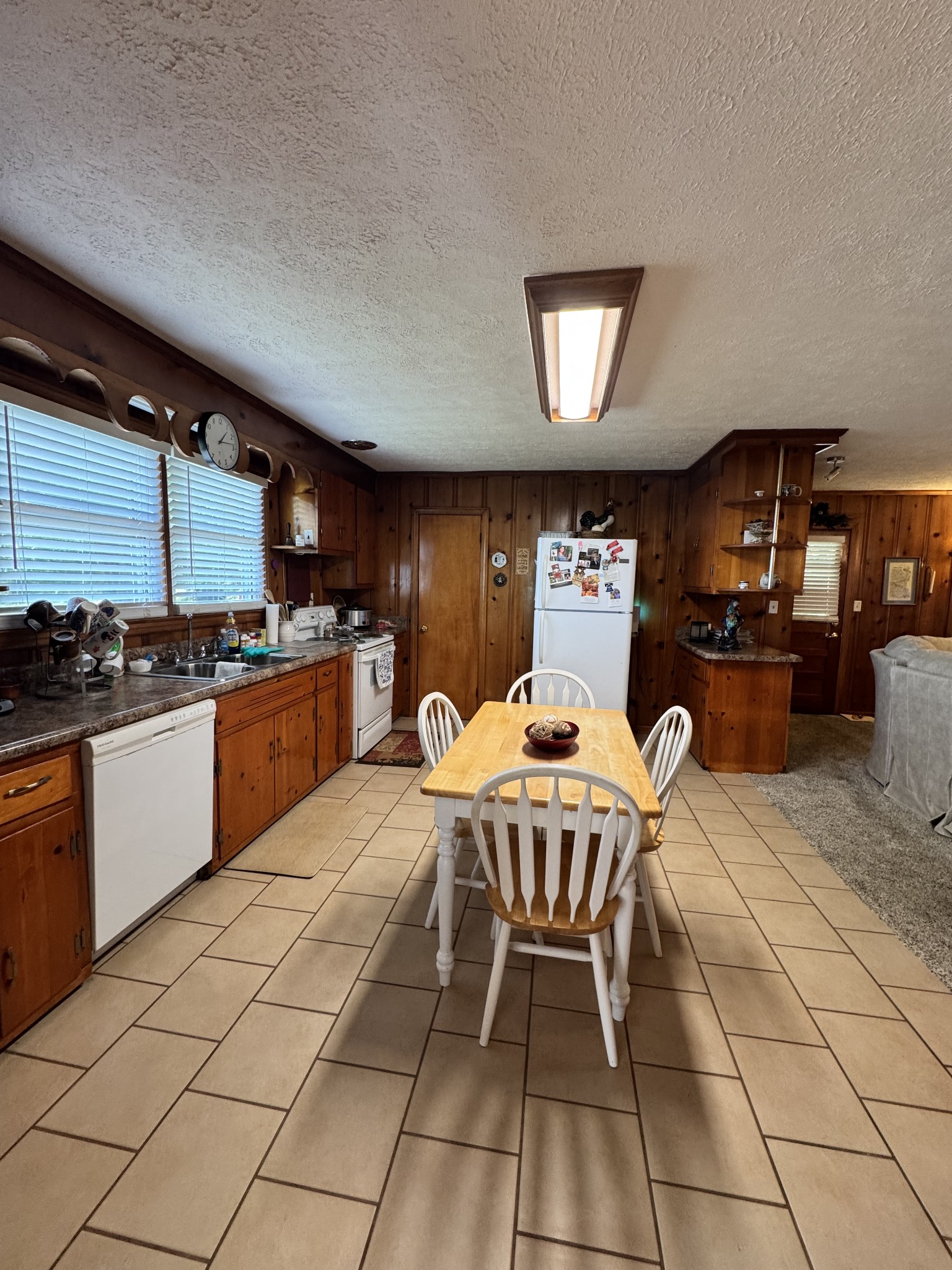 17 Turkey Creek Road Carthage, TN 37030 - Photo 13 of 40 a kitchen with stainless steel appliances granite countertop a sink a stove a dining table and chairs