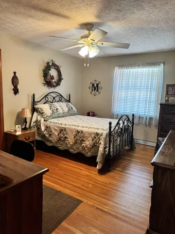 a view of house with yard and outdoor seating