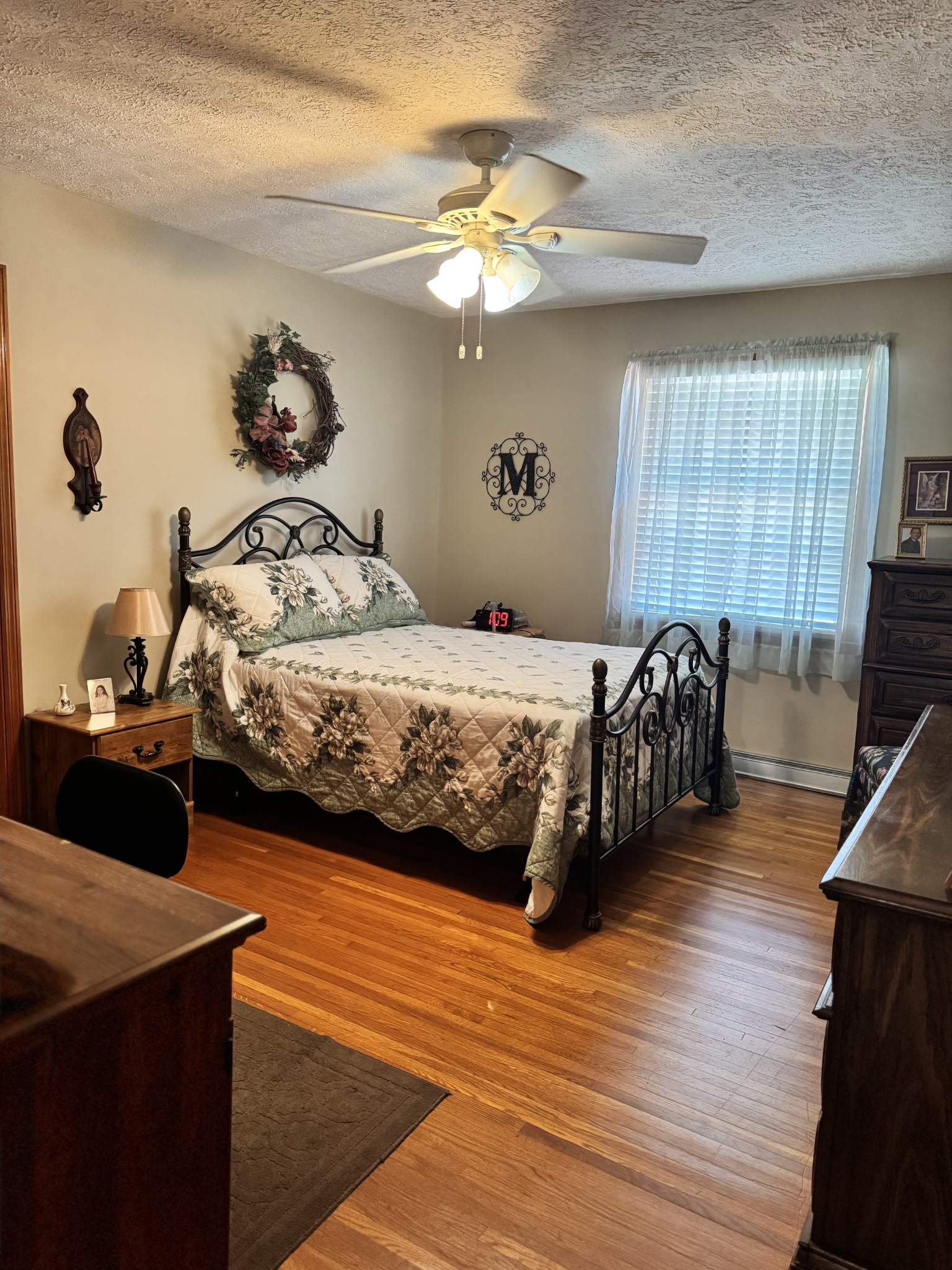 17 Turkey Creek Road Carthage, TN 37030 - Photo 30 of 40 a bedroom with a bed and a chandelier