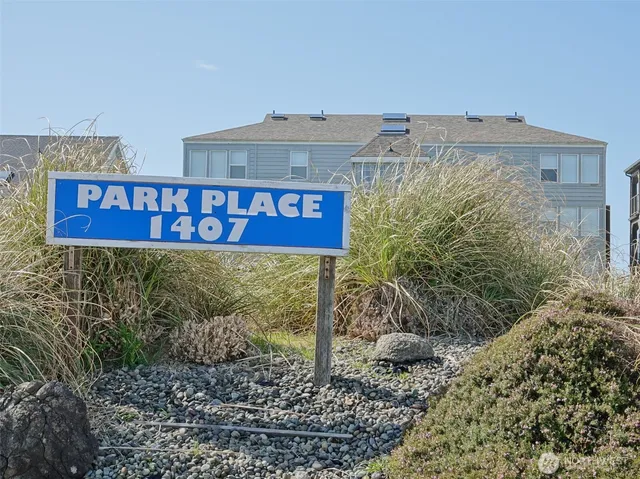 a sign that is on a brick wall