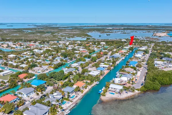 a front view of a house with plants