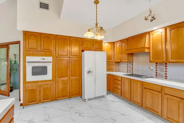 a living room with lots of furniture and white walls
