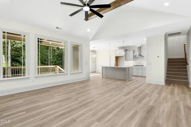 a kitchen with kitchen island a sink stainless steel appliances and cabinets
