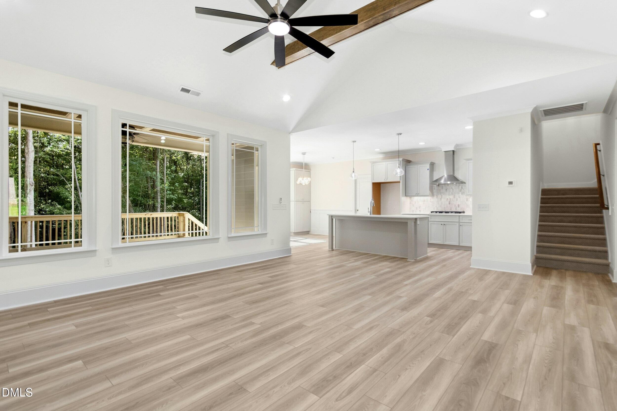 925 Lynch Road Selma, NC 27576 - Photo 14 of 39 a view of an empty room with a window and wooden floor