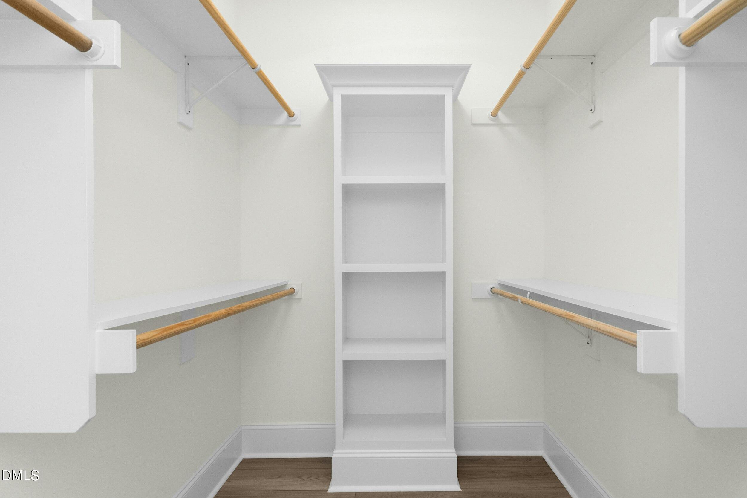 925 Lynch Road Selma, NC 27576 - Photo 19 of 39 a view of walk in closet with empty racks