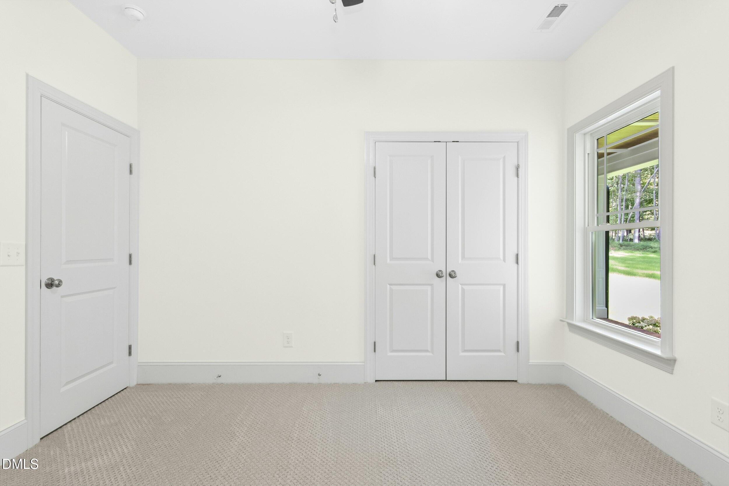 925 Lynch Road Selma, NC 27576 - Photo 23 of 39 a view of an empty room with a window