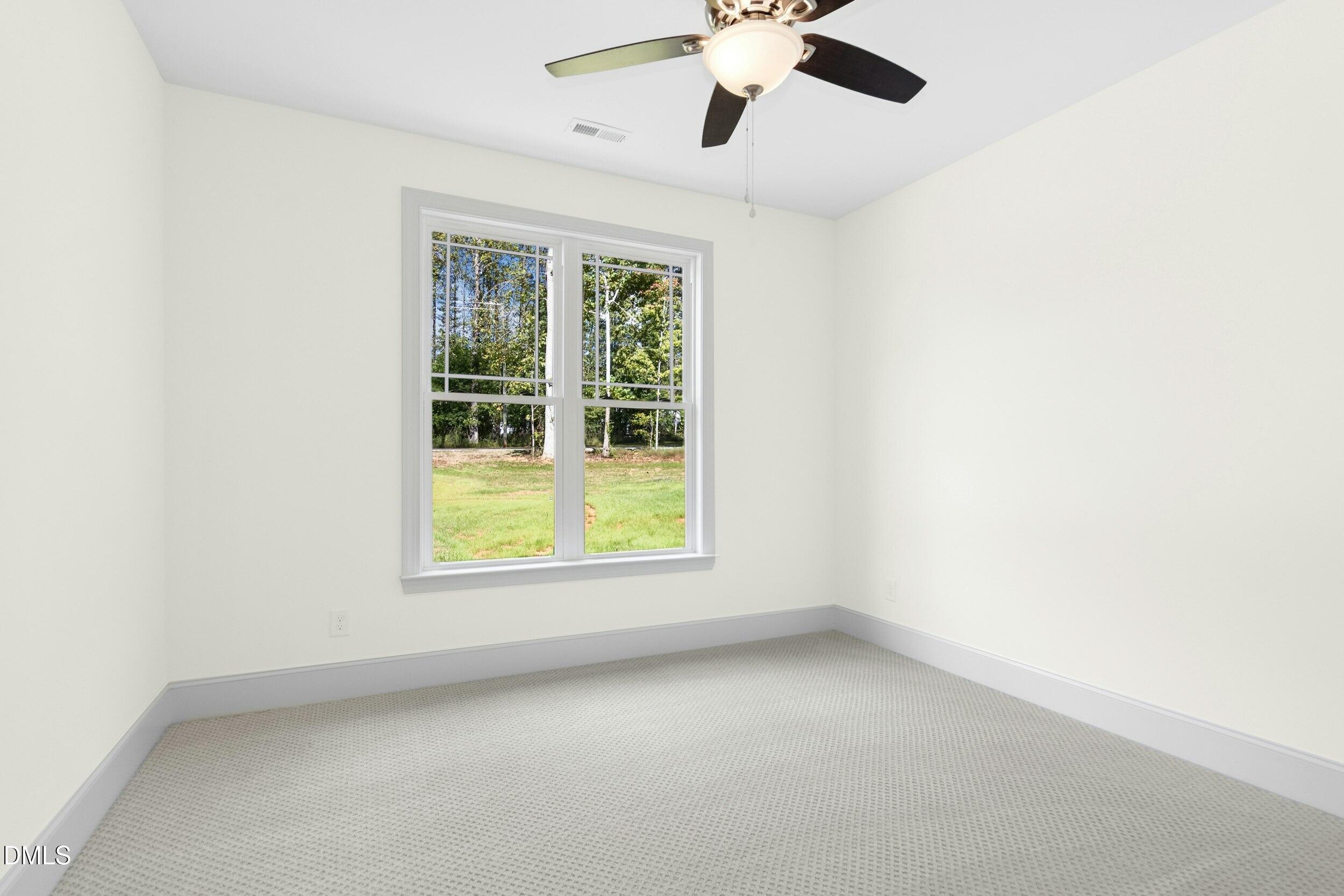 925 Lynch Road Selma, NC 27576 - Photo 24 of 39 an empty room with a window
