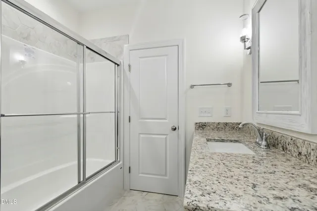 a view of room with window and ceiling fan