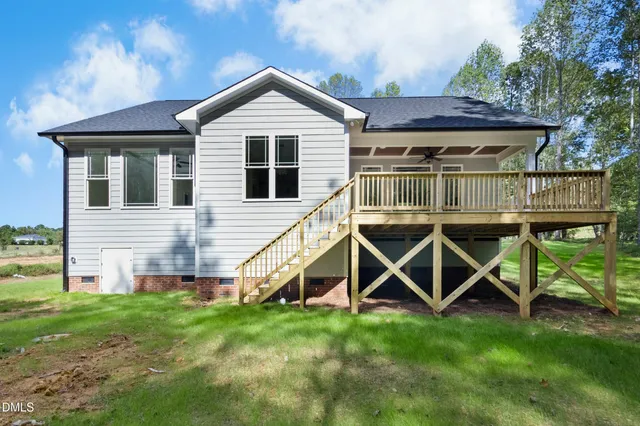 a view of house and outdoor space with yard