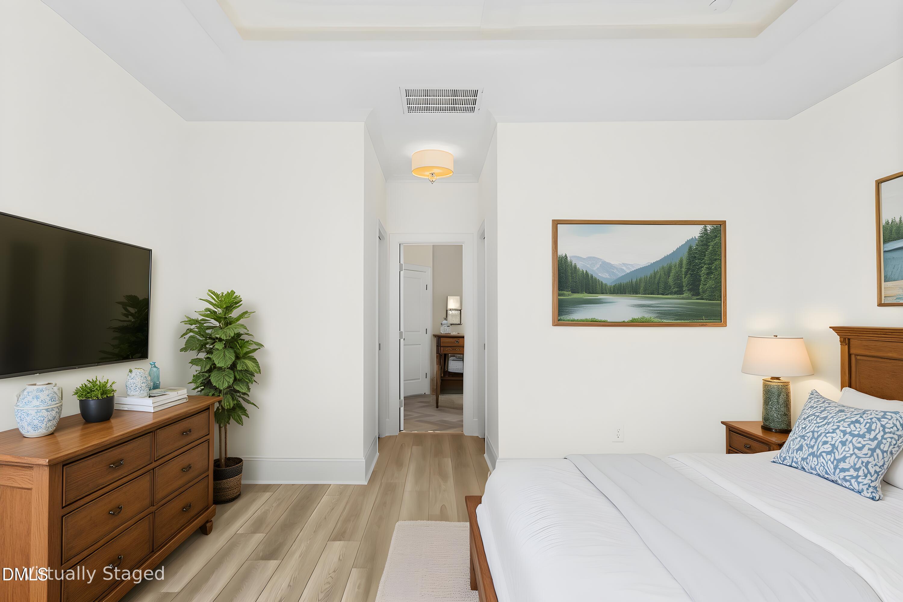 925 Lynch Road Selma, NC 27576 - Photo 8 of 39 a bedroom with a bed and a flat screen tv