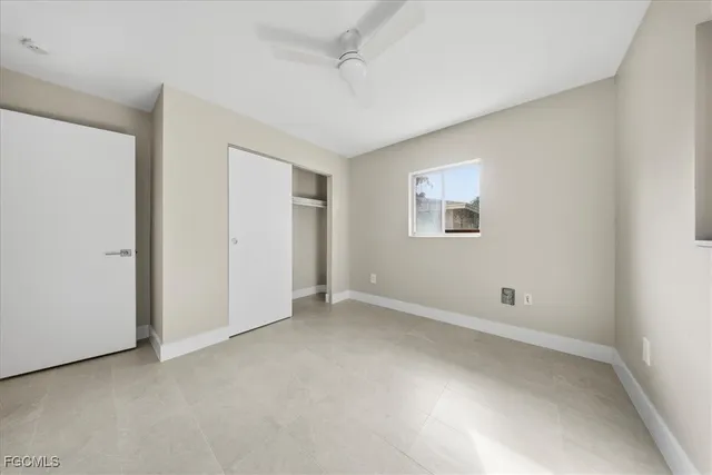 an empty room with a empty space and windows