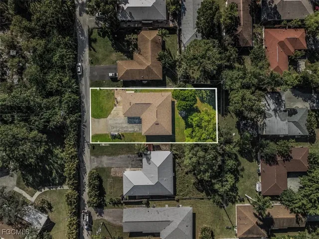 an aerial view of houses with outdoor space