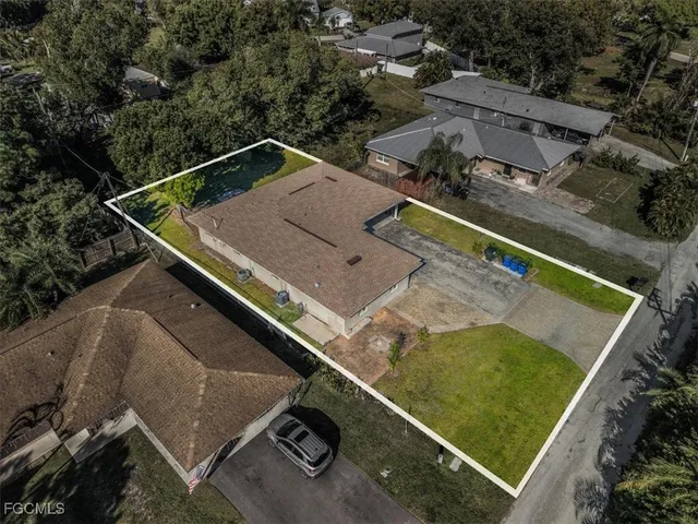 an aerial view of house with a swimming pool