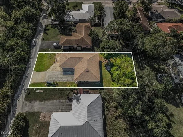 an aerial view of house with yard