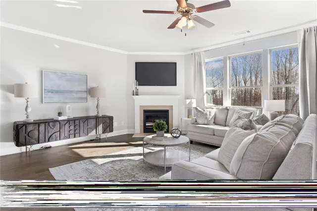 a living room with furniture fireplace and flat screen tv