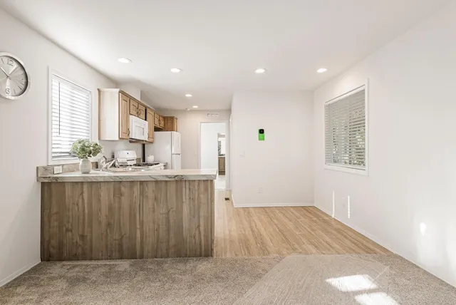 a view of kitchen with wooden floor and window