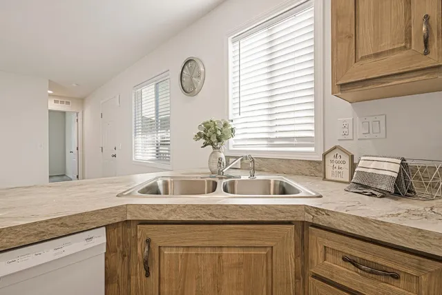 a kitchen with a sink and a window
